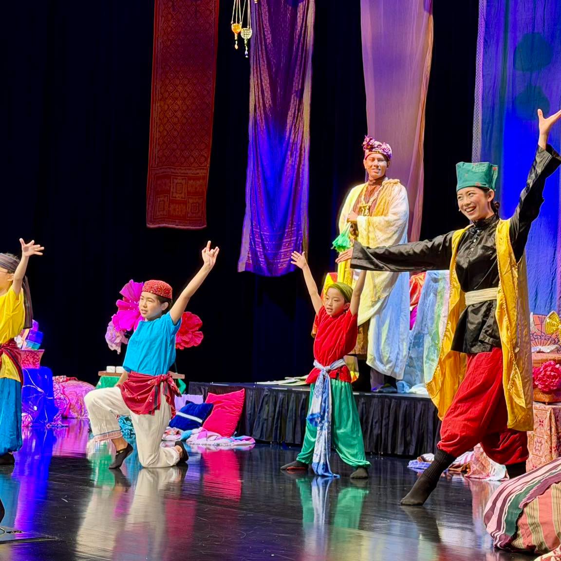 Performers in colourful costumes during The Nightingale