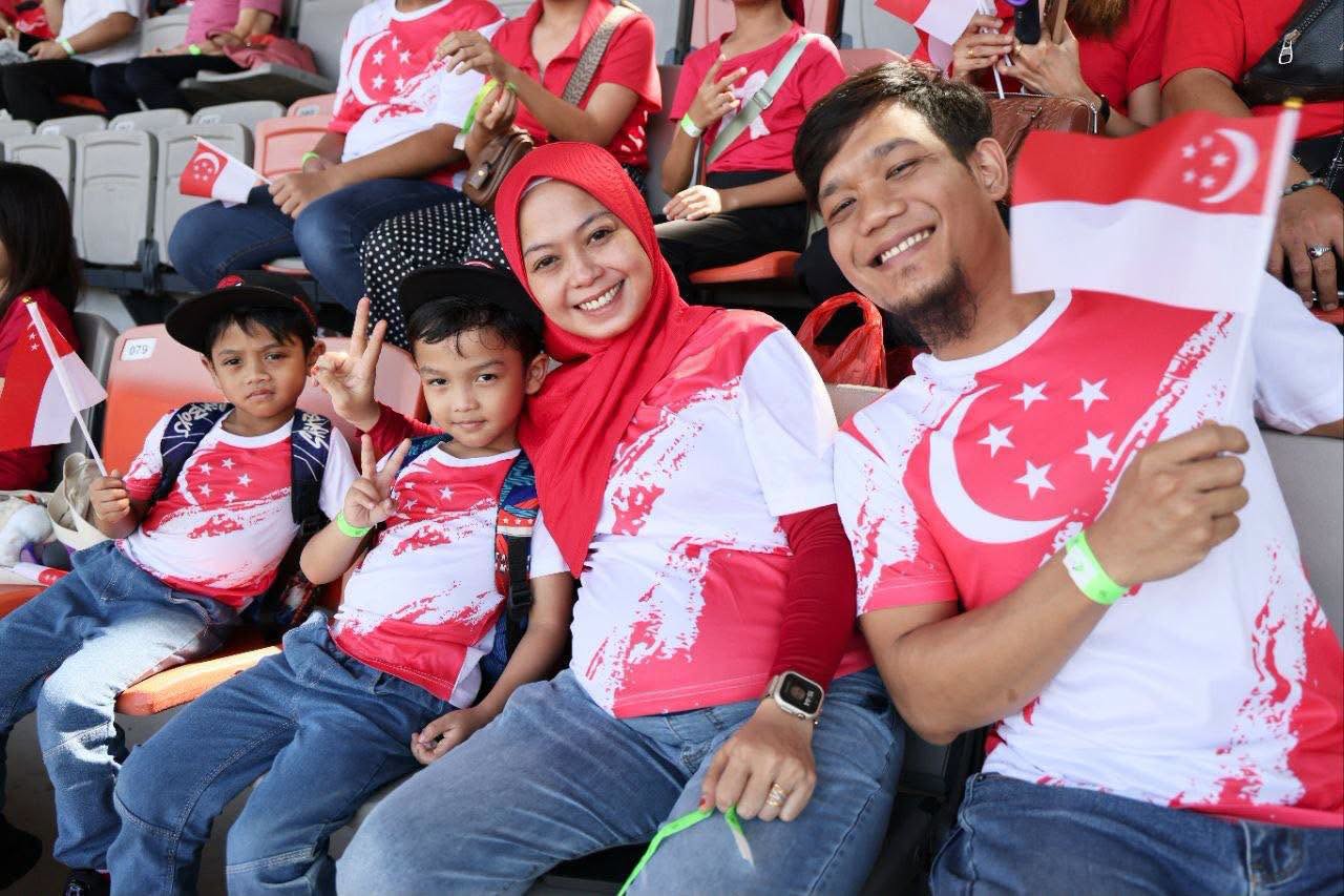 Attendees in Singapore-themed apparel at OTH concert