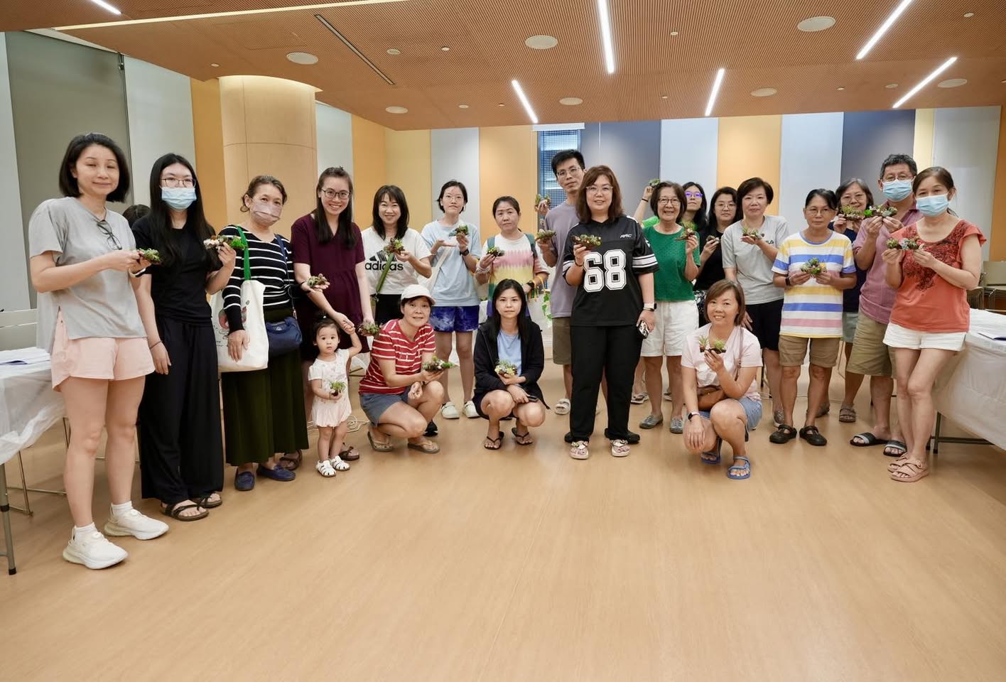Participants actively crafting their airplant driftwood art