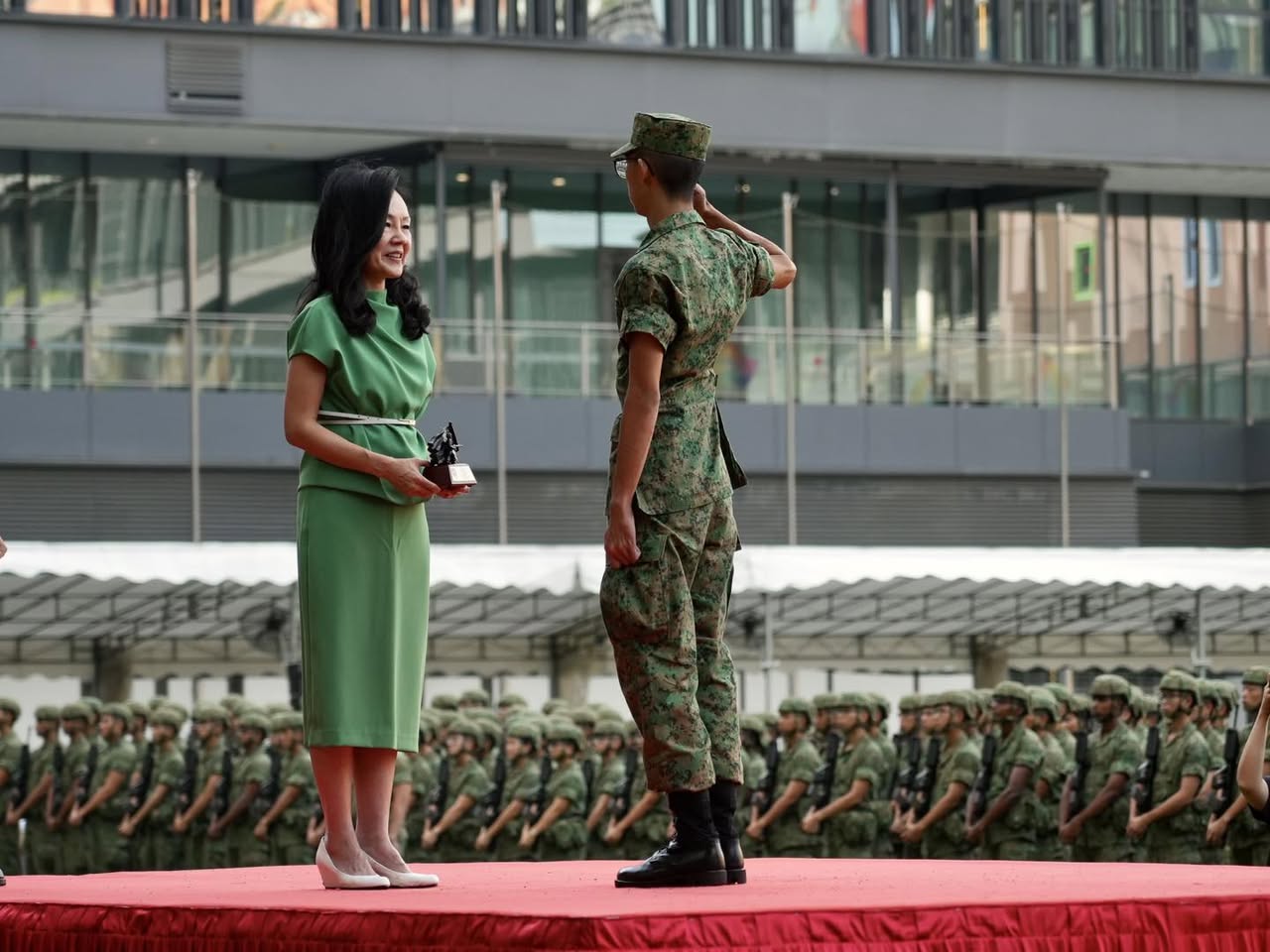 Graduating recruits standing in formation at Town Square during the BMT parade.