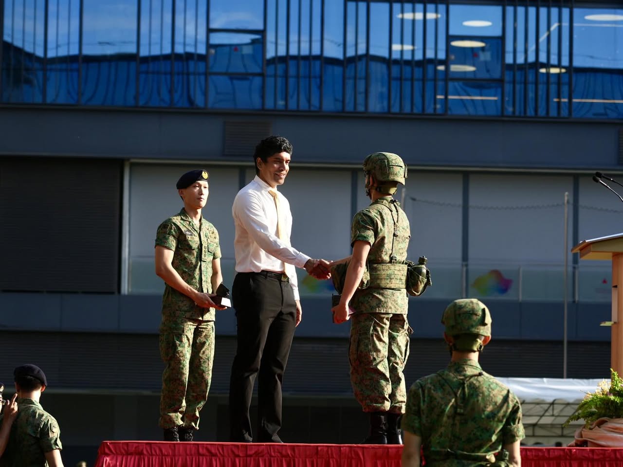 A Reviewing Officer addressing the parade with a solemn expression.