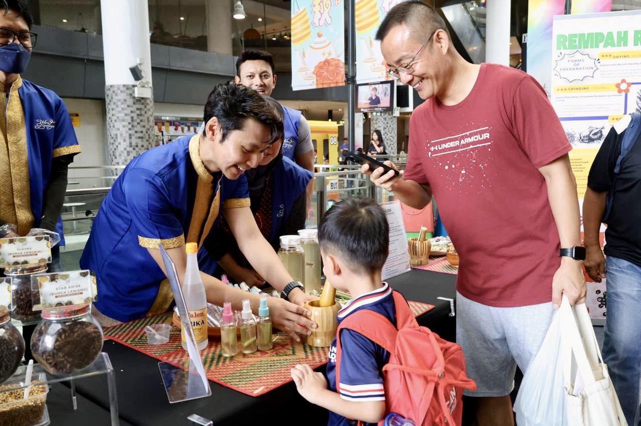 Attendees engaging with cultural displays at Bulan Bahasa 2025