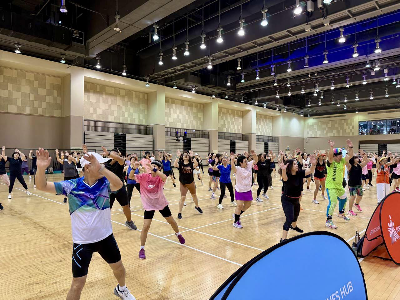 Joyful participants dancing to the electrifying beats at Our Tampines Hub