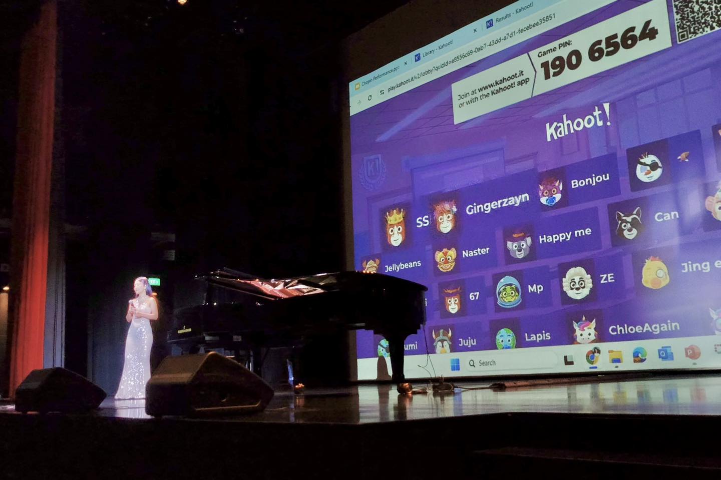 The stage of the Festive Arts Theatre, featuring a grand piano and elegant lighting.