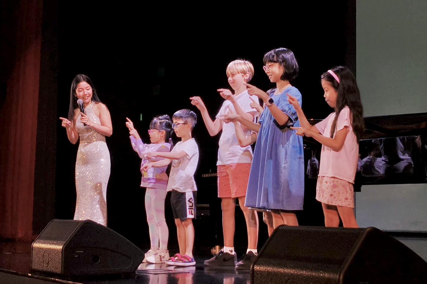 Pianist Churen Li performing on stage with a grand piano.
