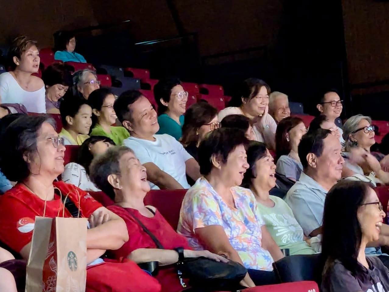 Audience members enjoying the Crosstalk SG60 performance