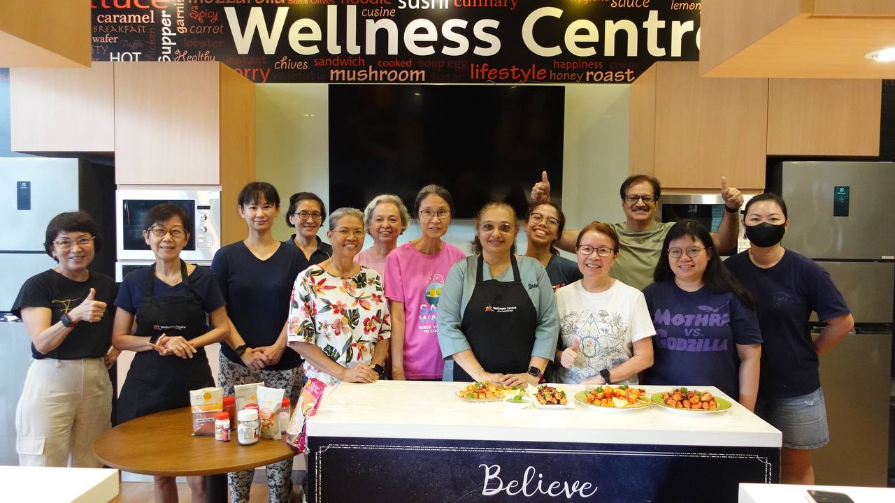 Participants actively marinating ingredients for tikka dishes.