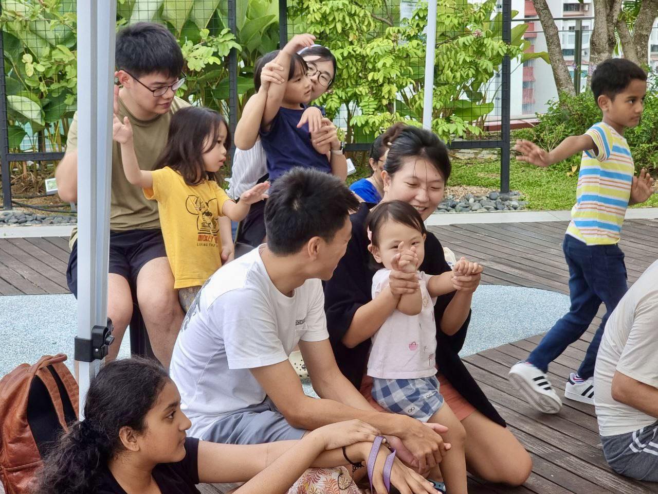 The Moon Fairy captivating an audience with a tale at Stories from the Garden.