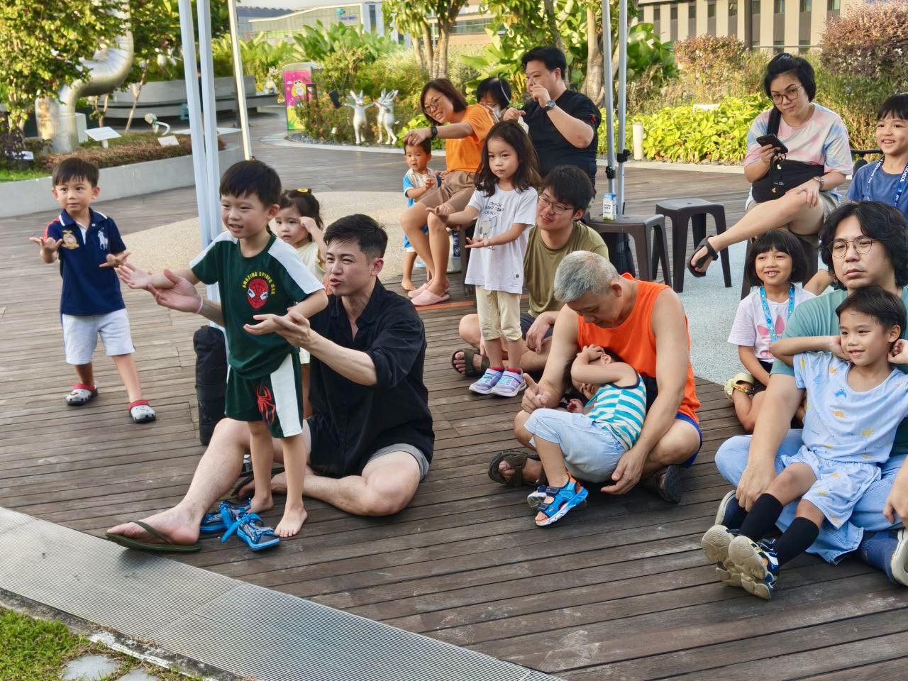 Families attending the storytelling session at OTH Wellness Garden