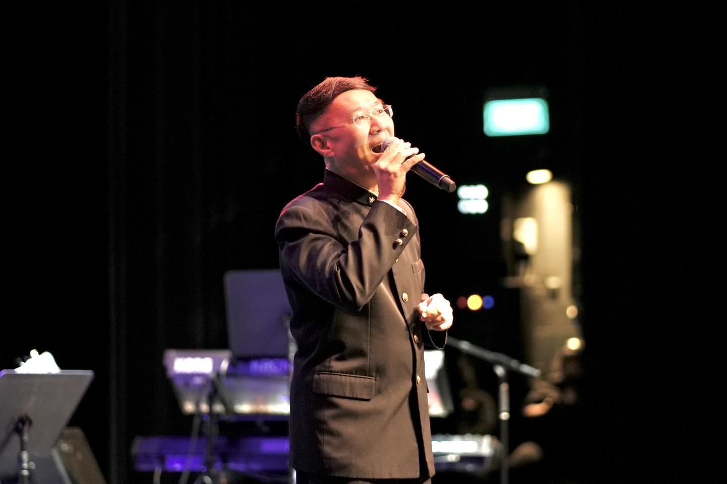 Local vocalists Xie Sheng Zhi and Changpin performing on stage during the tribute concert.