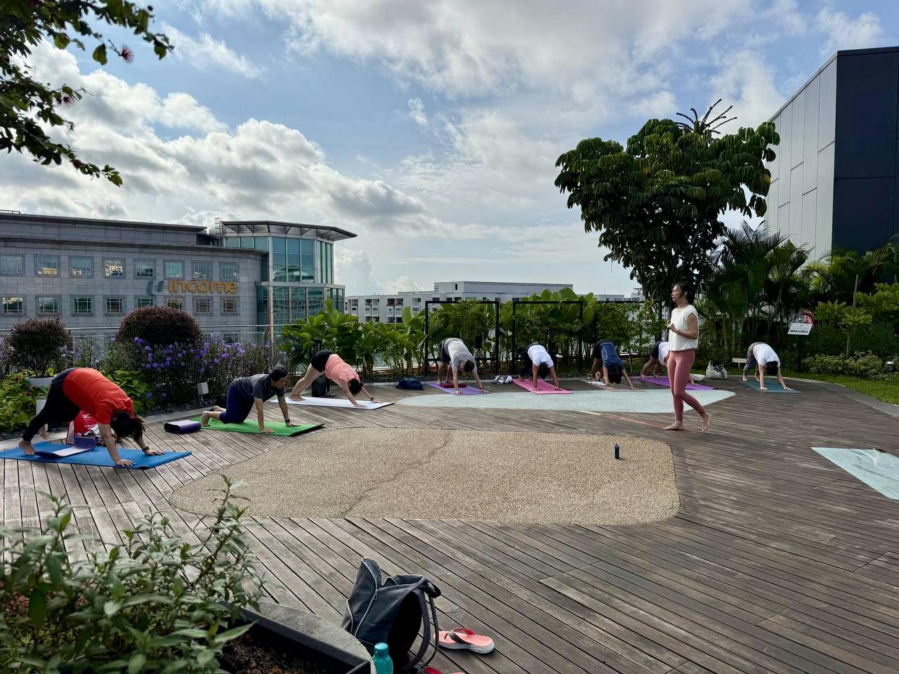 Instructor leading a Hatha Yoga session outdoors