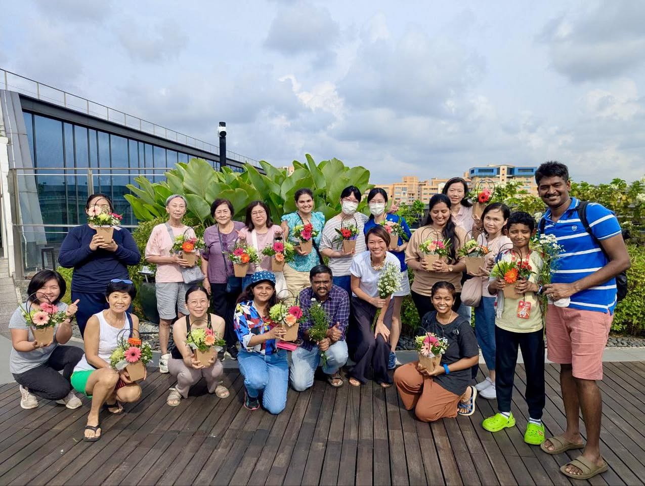 Close-up of hands arranging fresh flowers in a vase