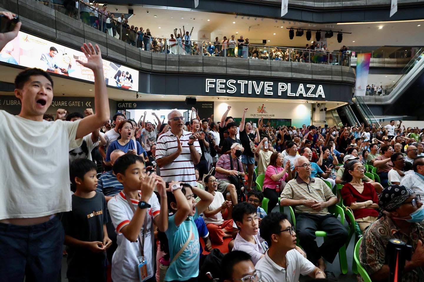 Crowd gathered at Festive Plaza near Gate 9 entrance