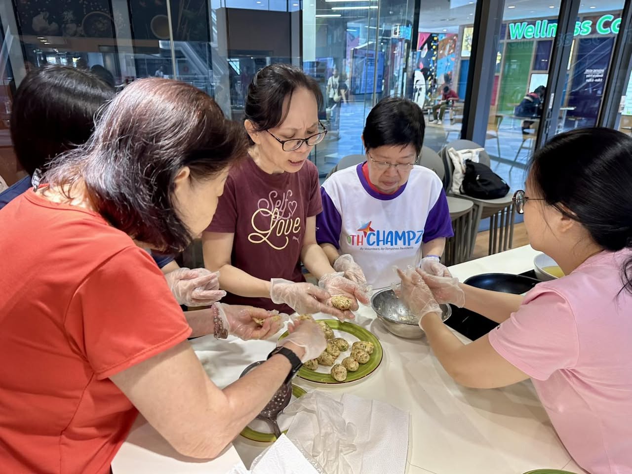Participants actively learning to make chicken croquettes