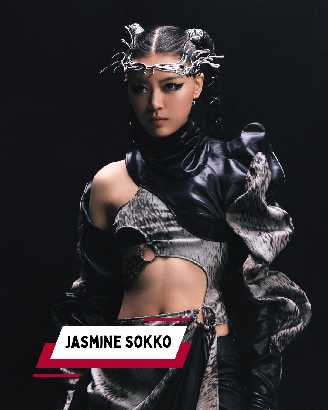 Jasmine Sokko, a Singaporean singer-songwriter, performing with her signature visor and mask.