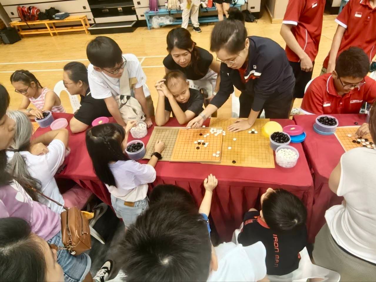 Participants playing Go at a public table