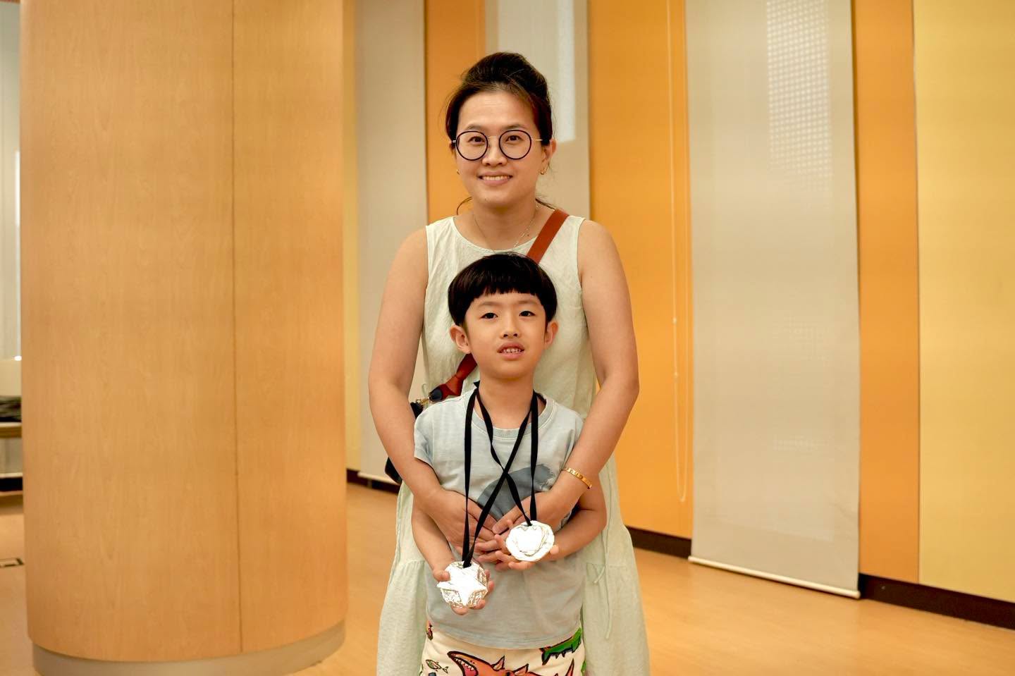 Family participants wearing their foil medals