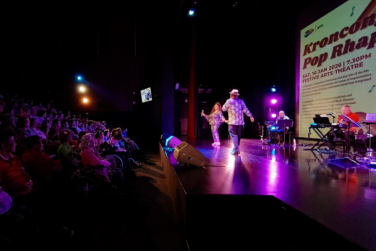 Vocalists delivering a soulful performance during the rhapsody