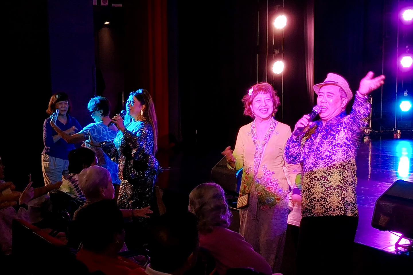 Musicians performing live on stage at the Festive Arts Theatre