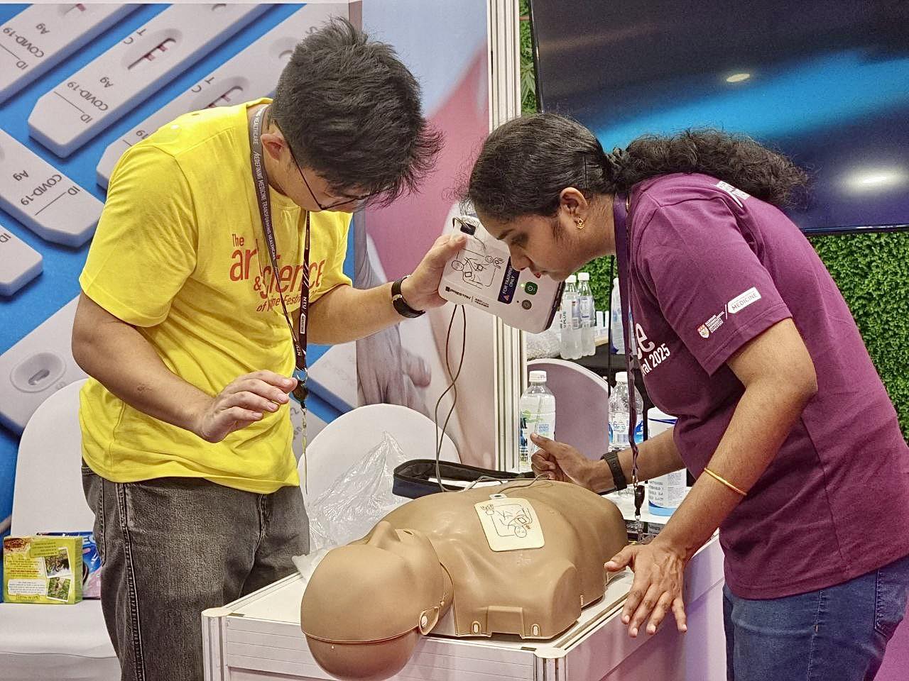 Attendees engaging in various activities at the Art & Science of Medicine Festival