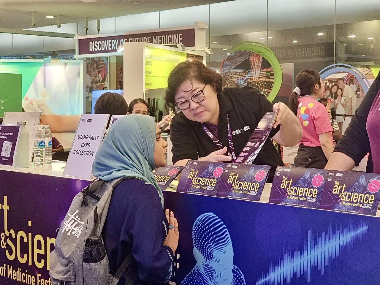 Participants enjoying the interactive exhibits at the festival