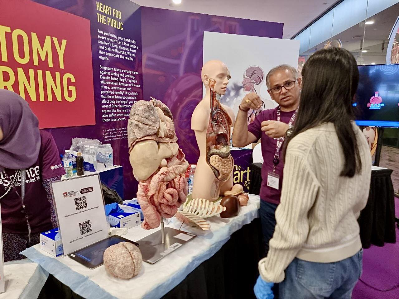 Hands-on science demonstration captivating an audience at the festival