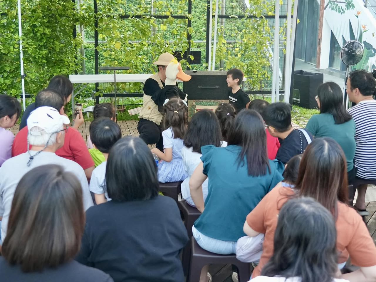 A wide shot of the lively event at OTH Wellness Garden