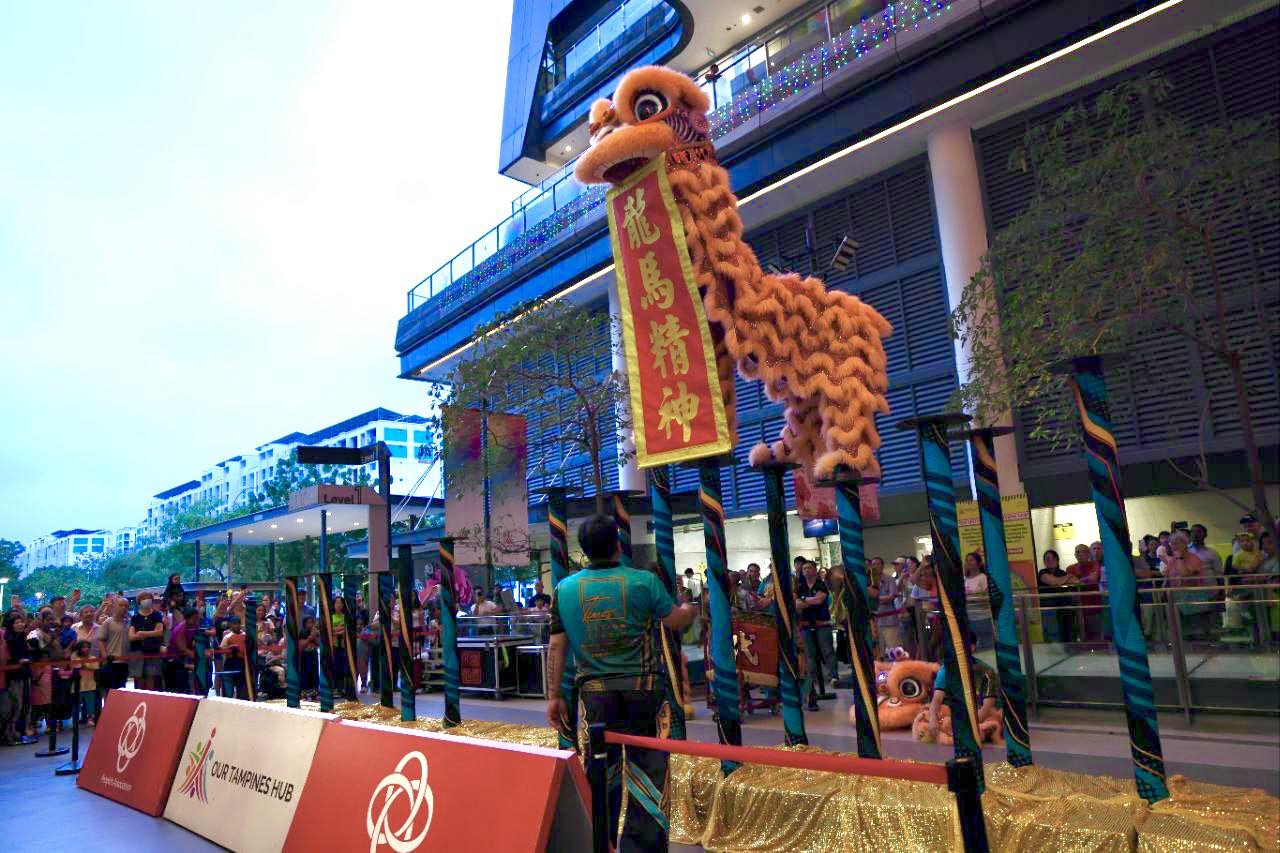 Guests participating in the festive Lo Hei toss at Central Plaza