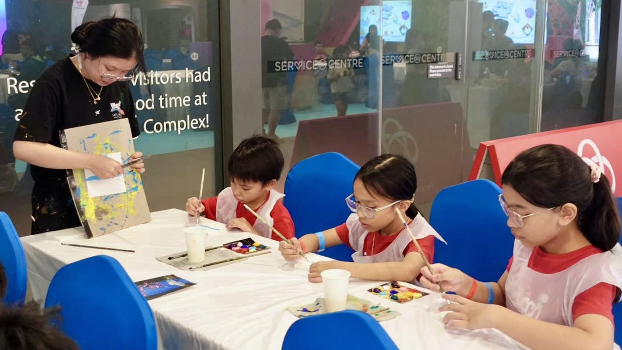 Volunteers distributing gift packs to families at OTH Giveback 2025