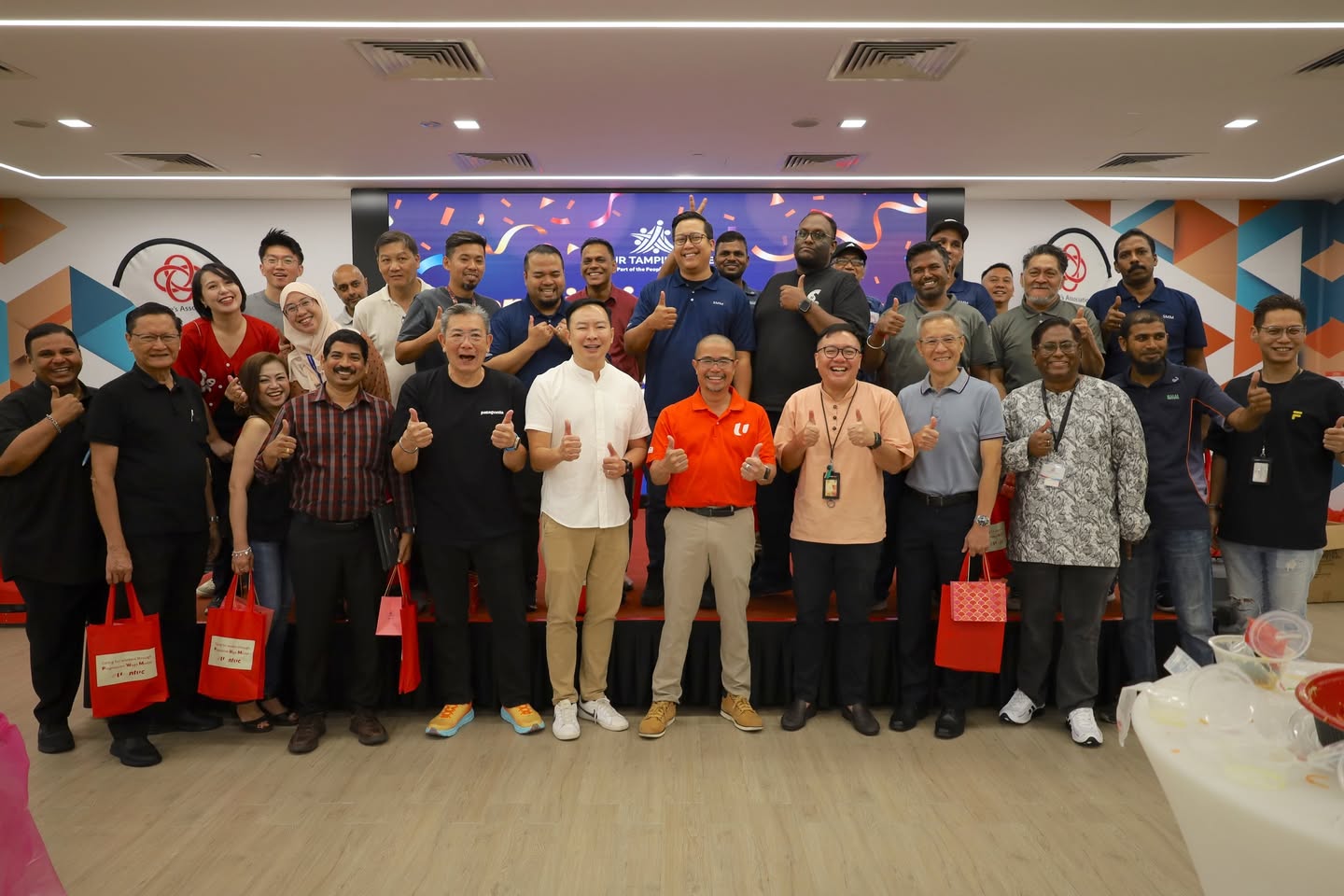 Group photo of the OTH service crew and management