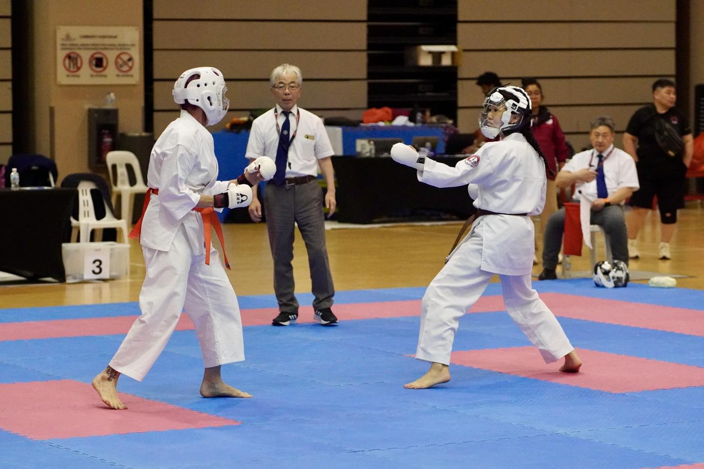 Competitors engaging in a spirited karate tournament