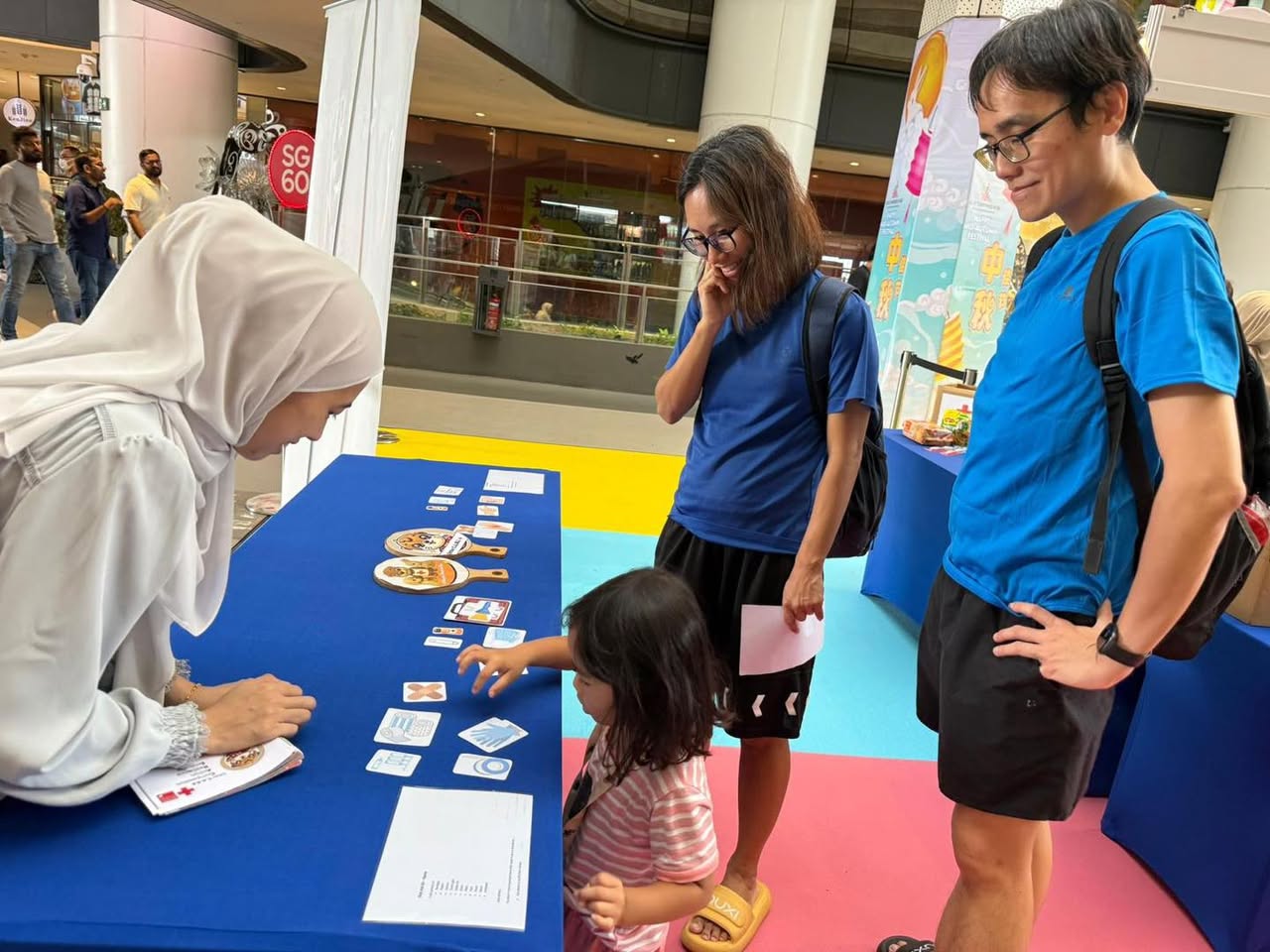 A group of children proudly displaying their handmade crafts