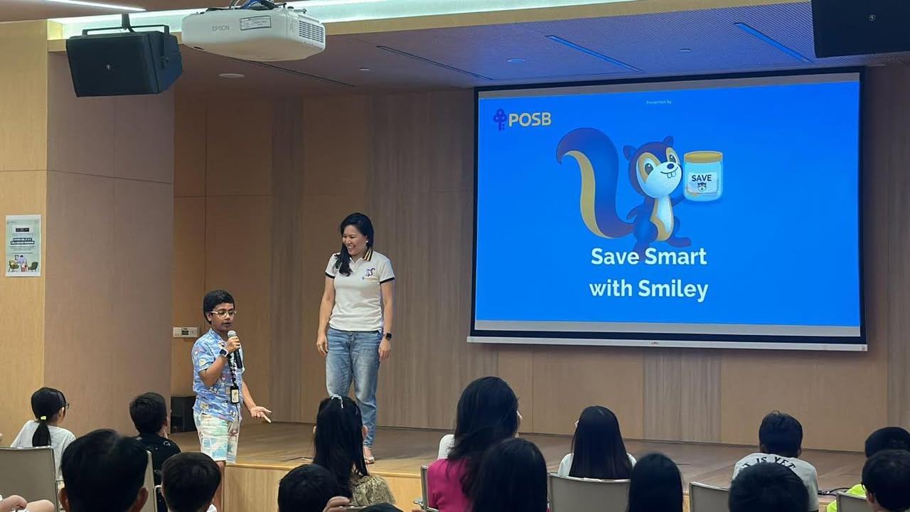 Children actively participating in a financial literacy workshop