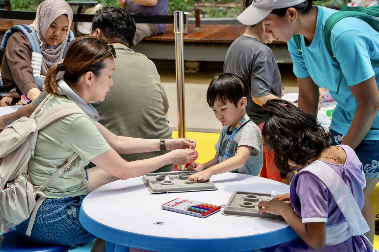 A child crafting a friendship bracelet