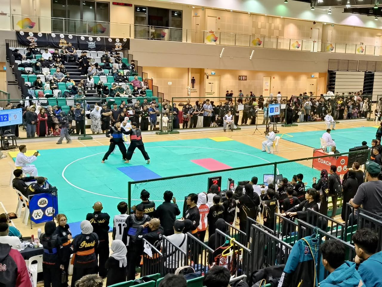Two Silat exponents demonstrating techniques during the championship