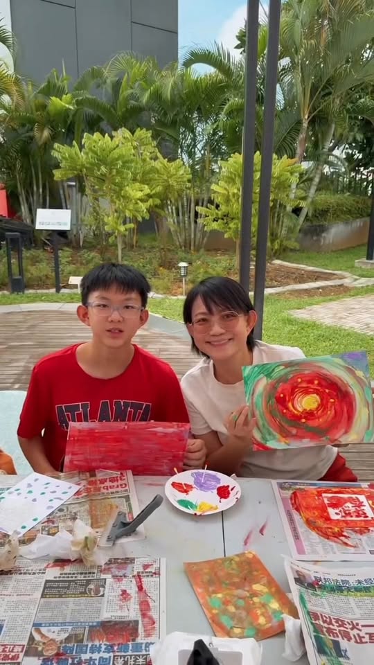 Completed abstract squeegee paintings by workshop participants at OTH Wellness Garden displaying colourful textured artwork