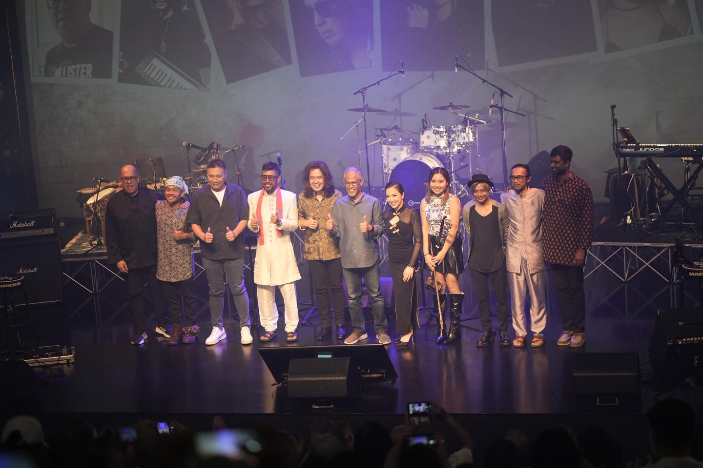 Musicians performing passionately on stage at Festive Arts Theatre