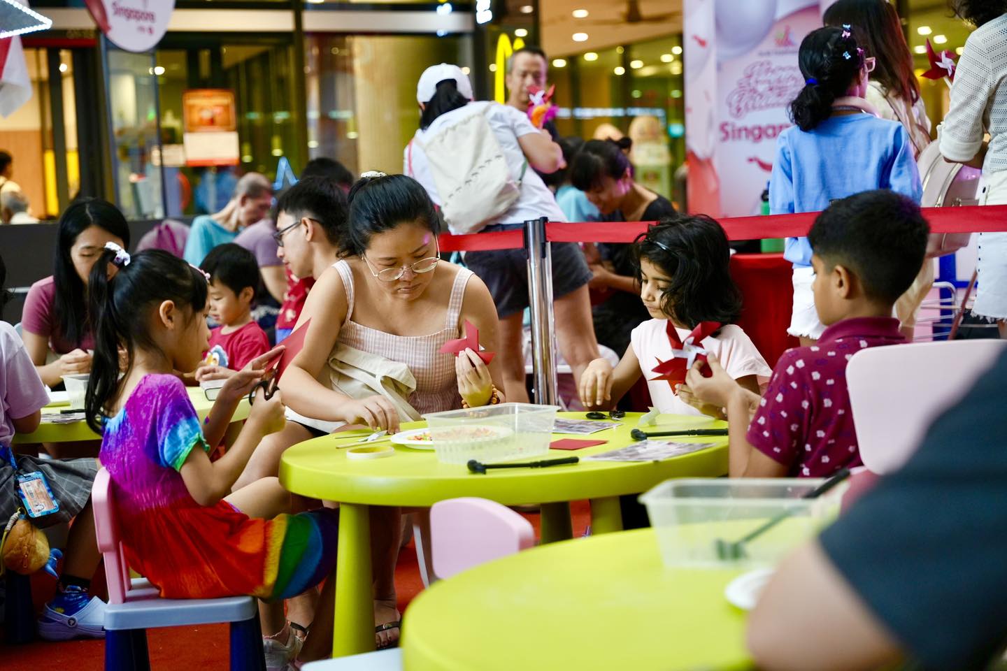 Vibrant crowd enjoying National Day celebrations at Our Tampines Hub