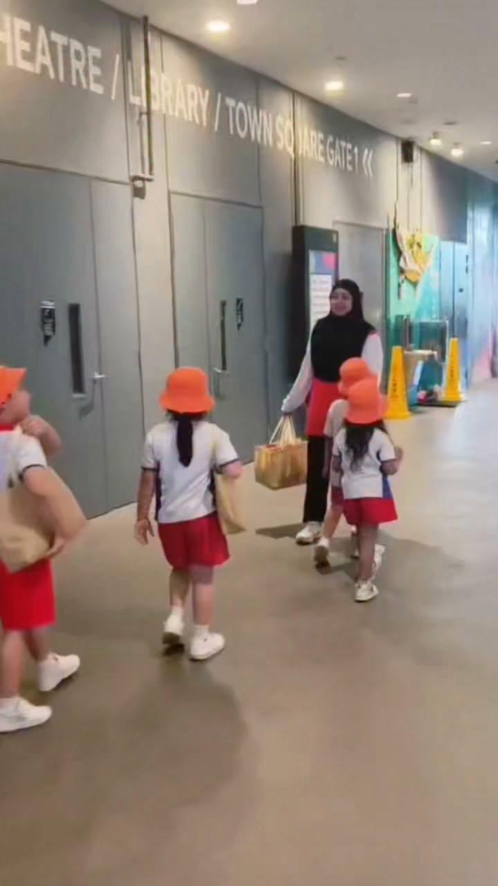 PCF Sparkletots preschool children distributing care packs at Our Tampines Hub Central Plaza