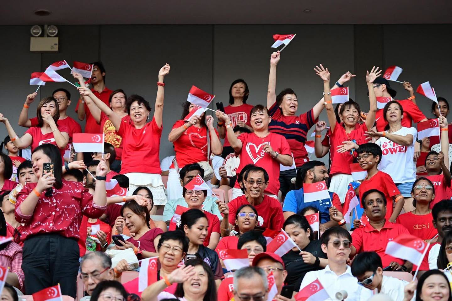 Crowd in red and white at Our Tampines Hub National Day Concert