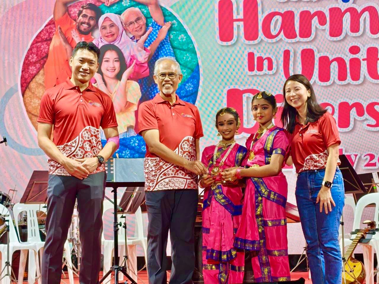 Cultural performers in traditional attire at harmony event