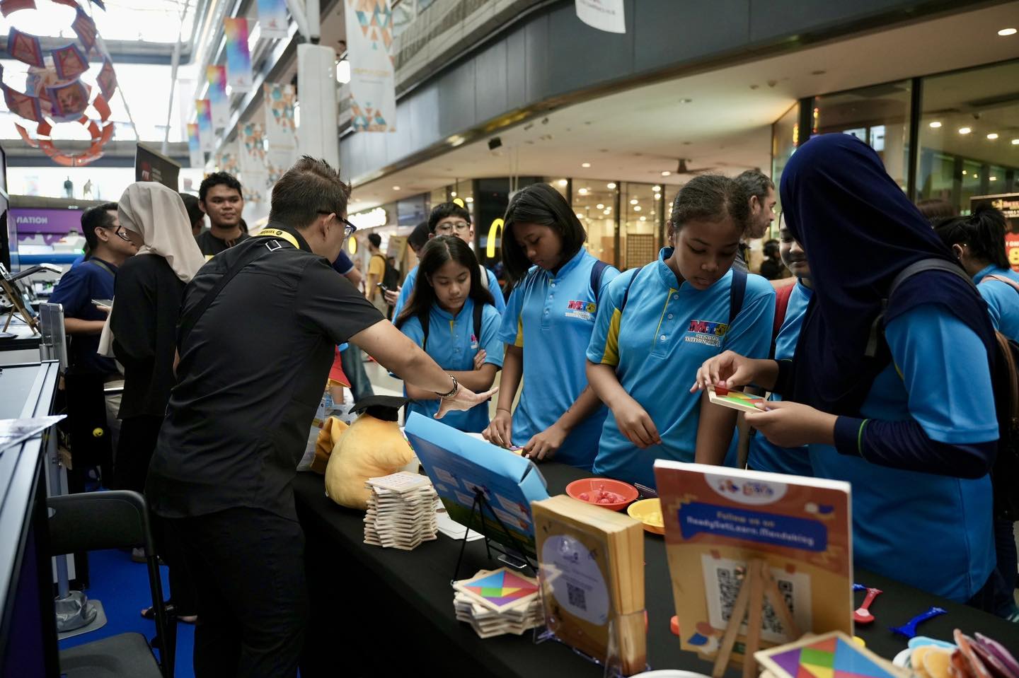 Children focused on a hands-on learning activity at the event.