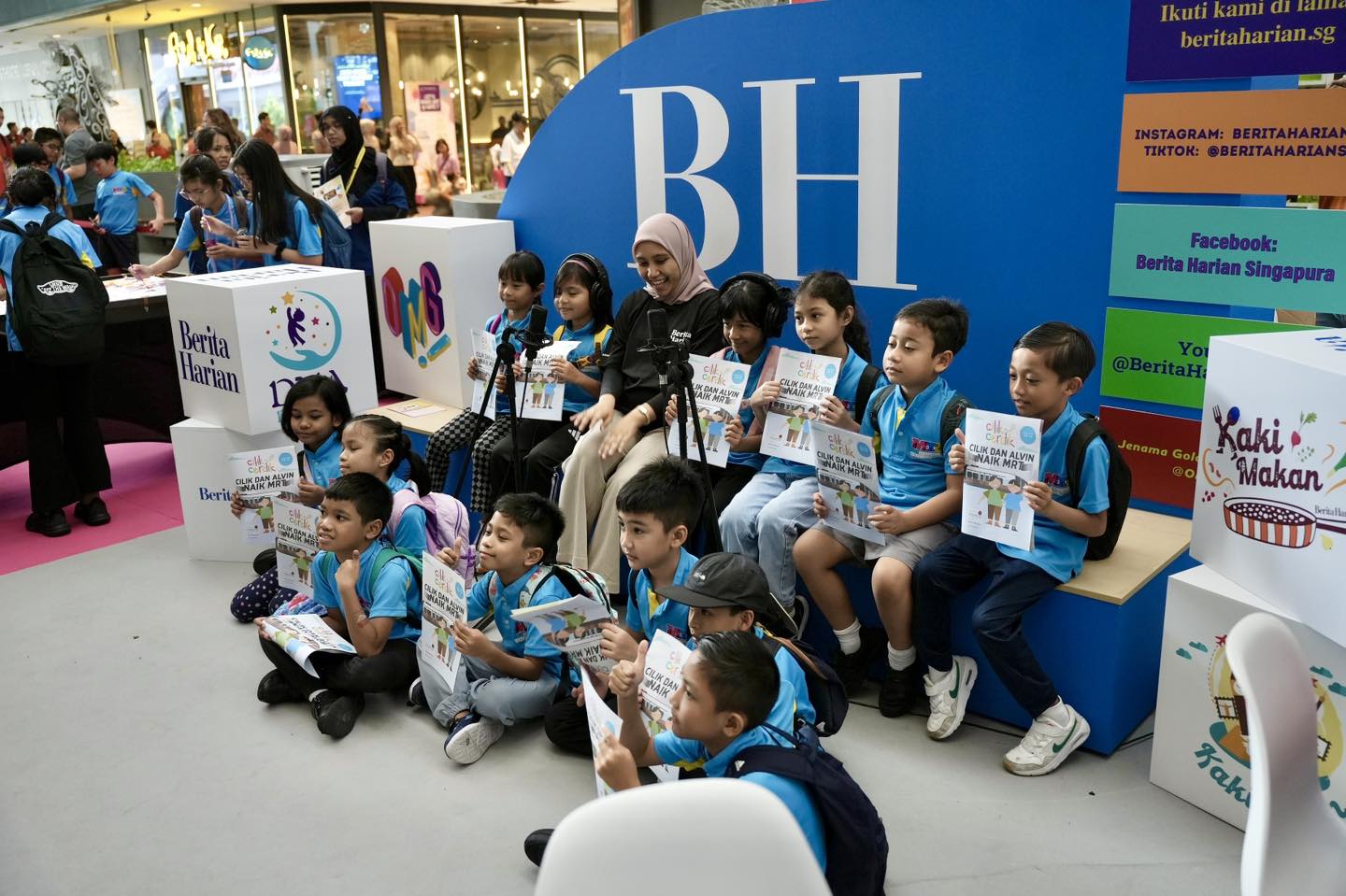 Attendees gathered around a workshop table, participating in a session.