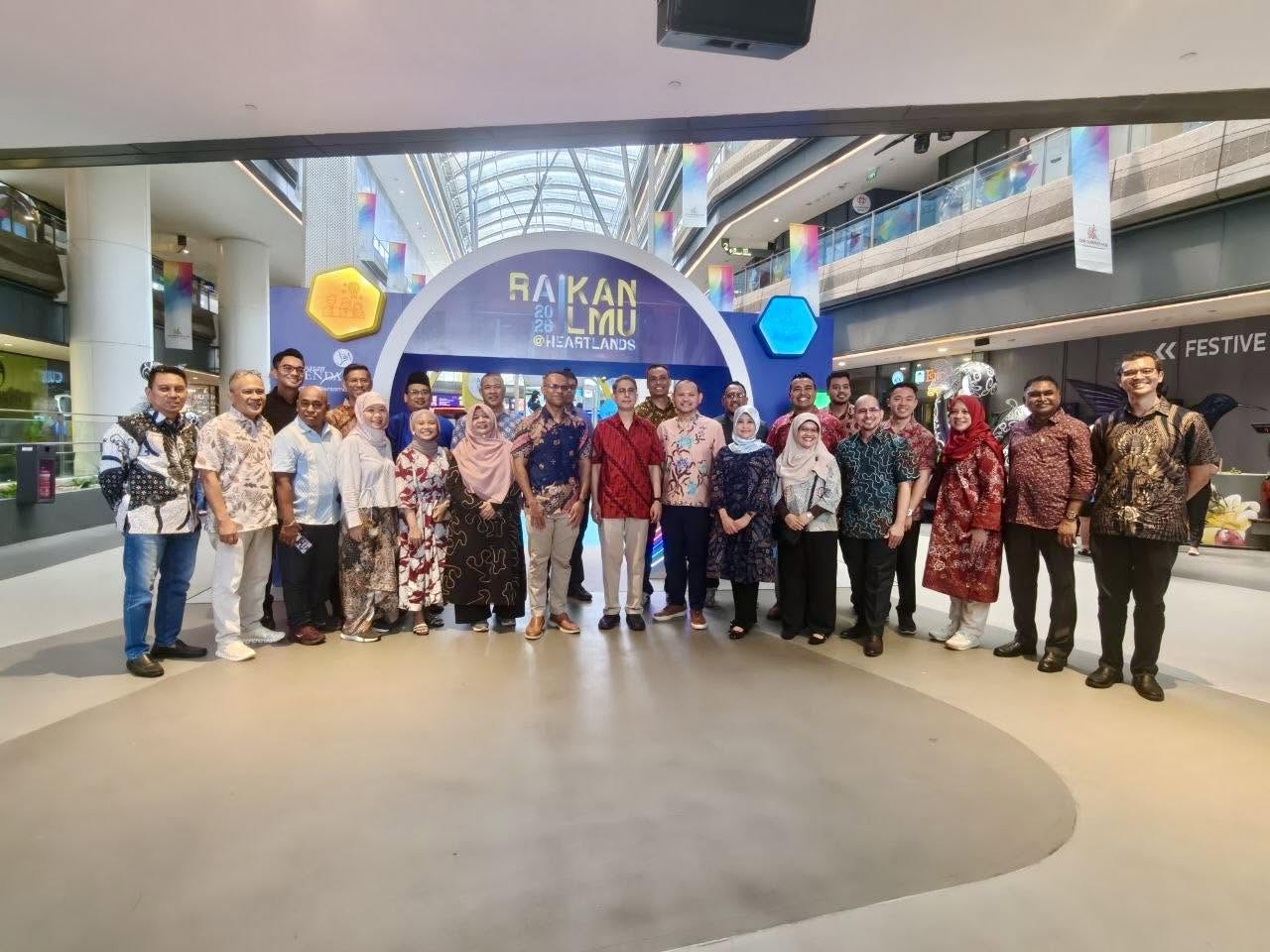Group photo at Raikan Ilmu at Heartlands 2026 event inside Our Tampines Hub with Raikan branding archway