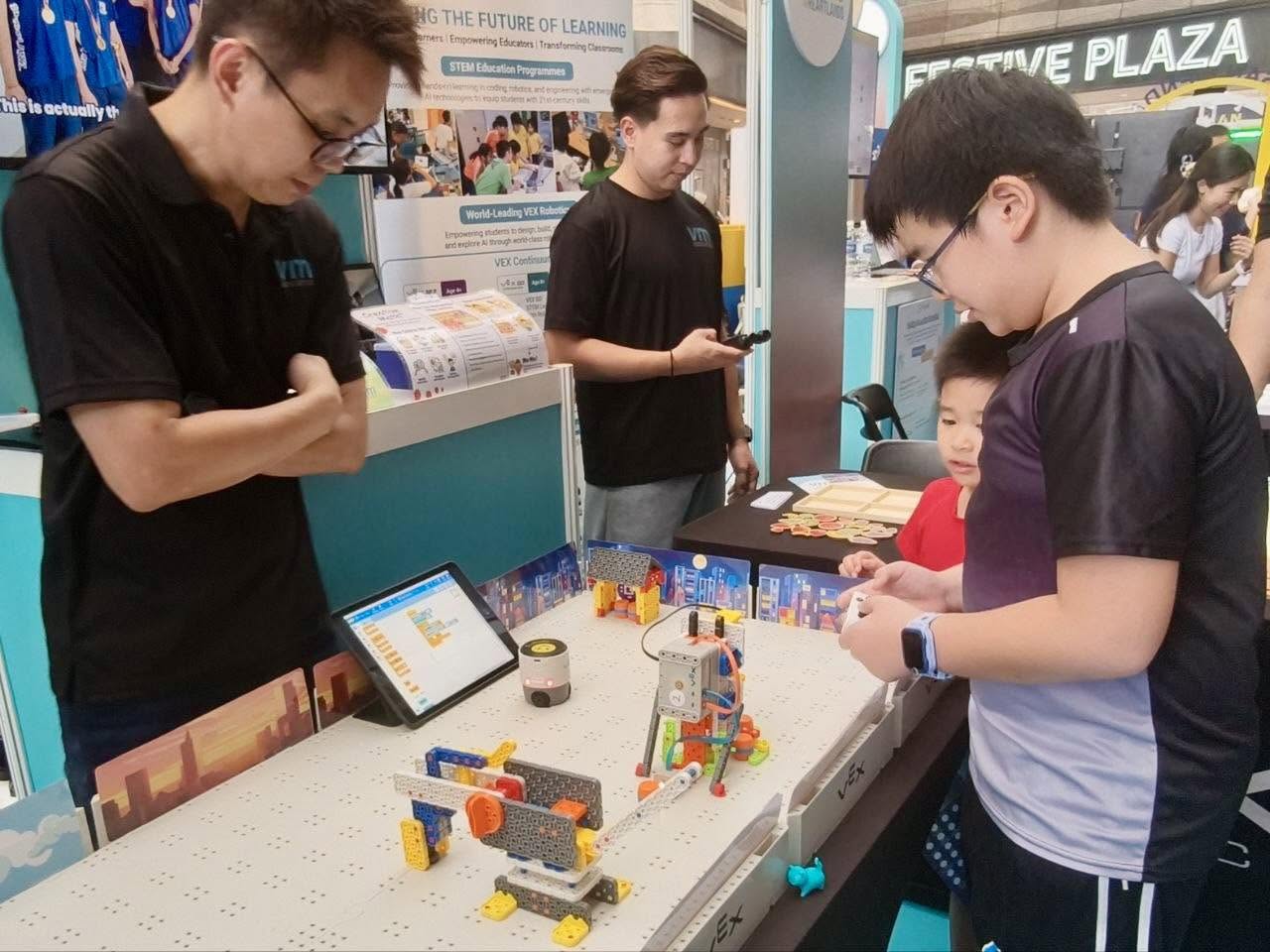 Visitors engaging with interactive exhibits at Raikan Ilmu Heartlands 2026 at Our Tampines Hub