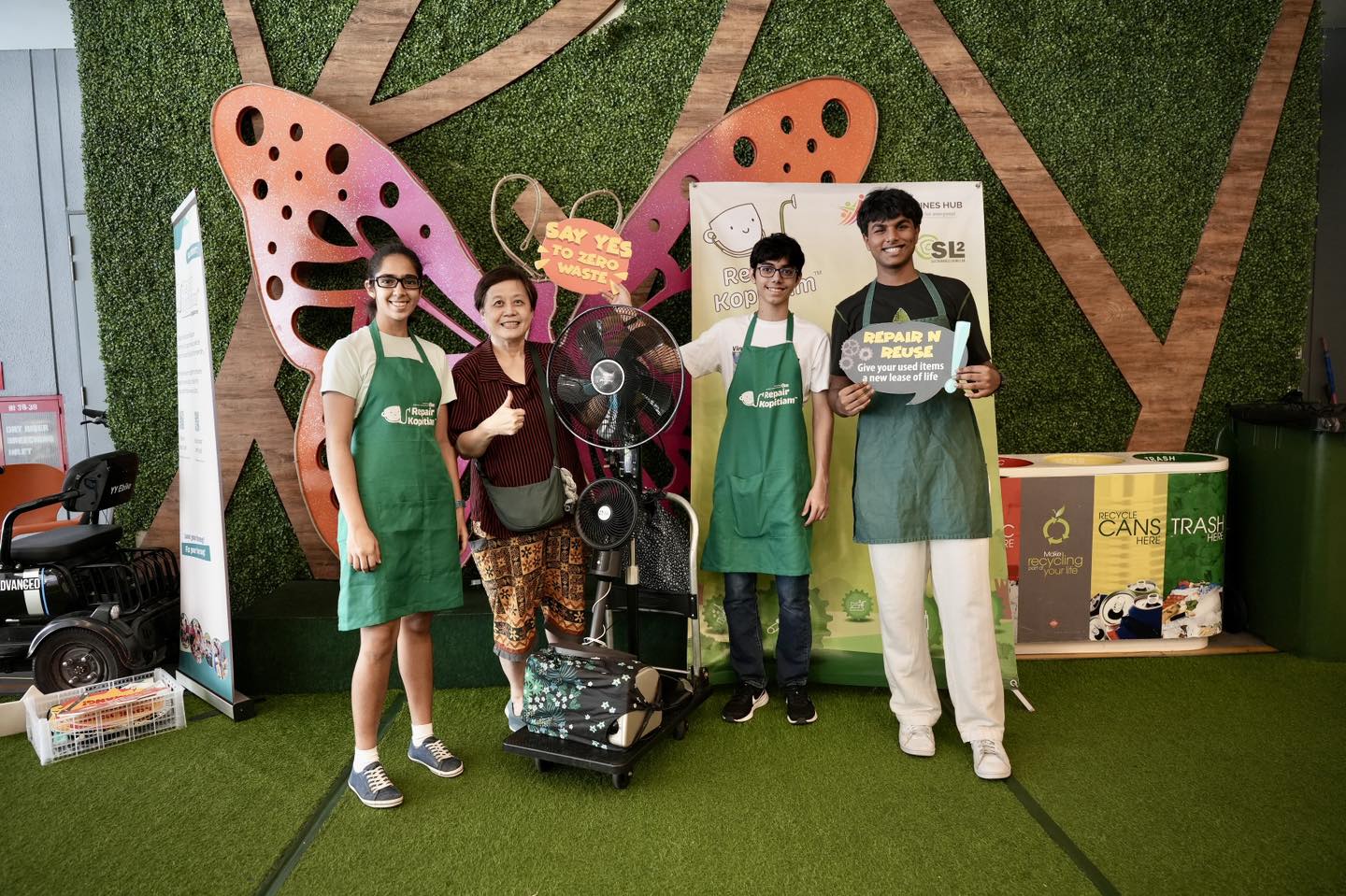 Various household items and tools laid out for repair at the event.