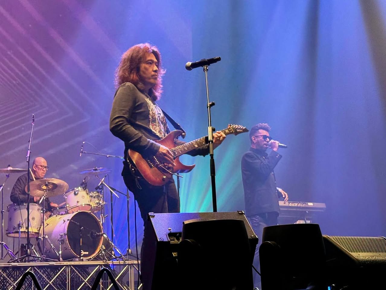 Live band with guitarist and singer performing Bon Jovi tribute