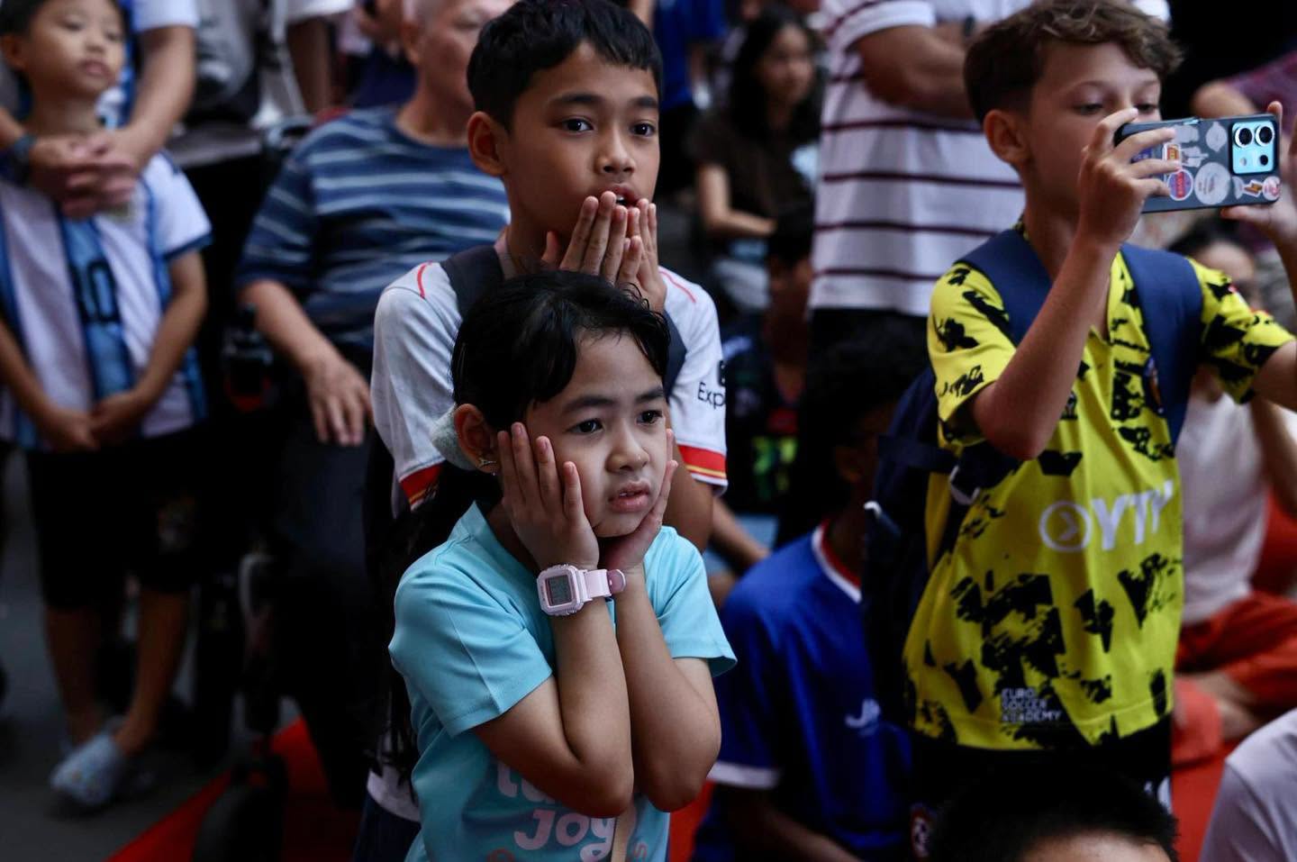 Children watching the live screening at Our Tampines Hub atrium