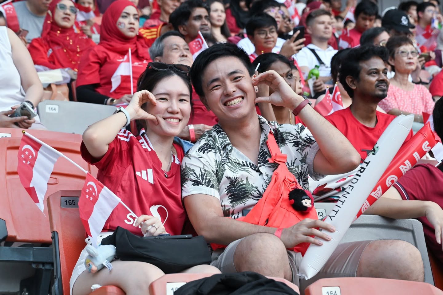 Families and individuals engaging in interactive exhibits and games