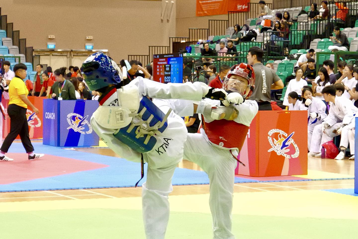 A moment of intense competition during the Taekwondo Kyorugi match